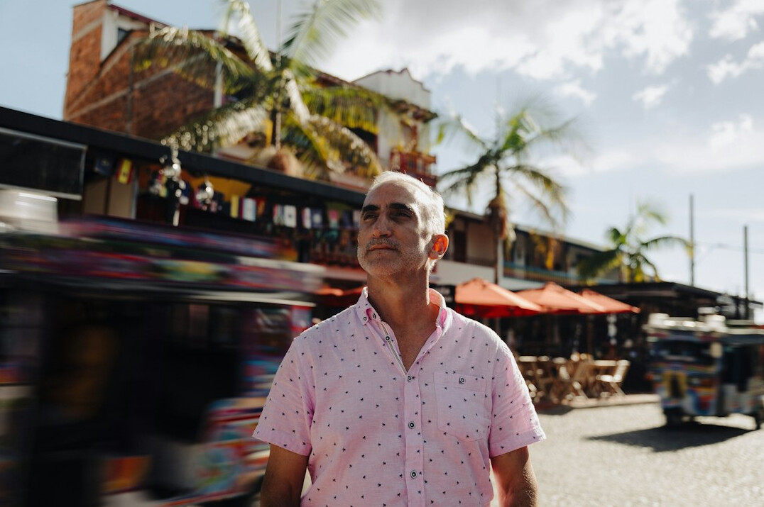 Portrait of a man in a shirt looking at camera